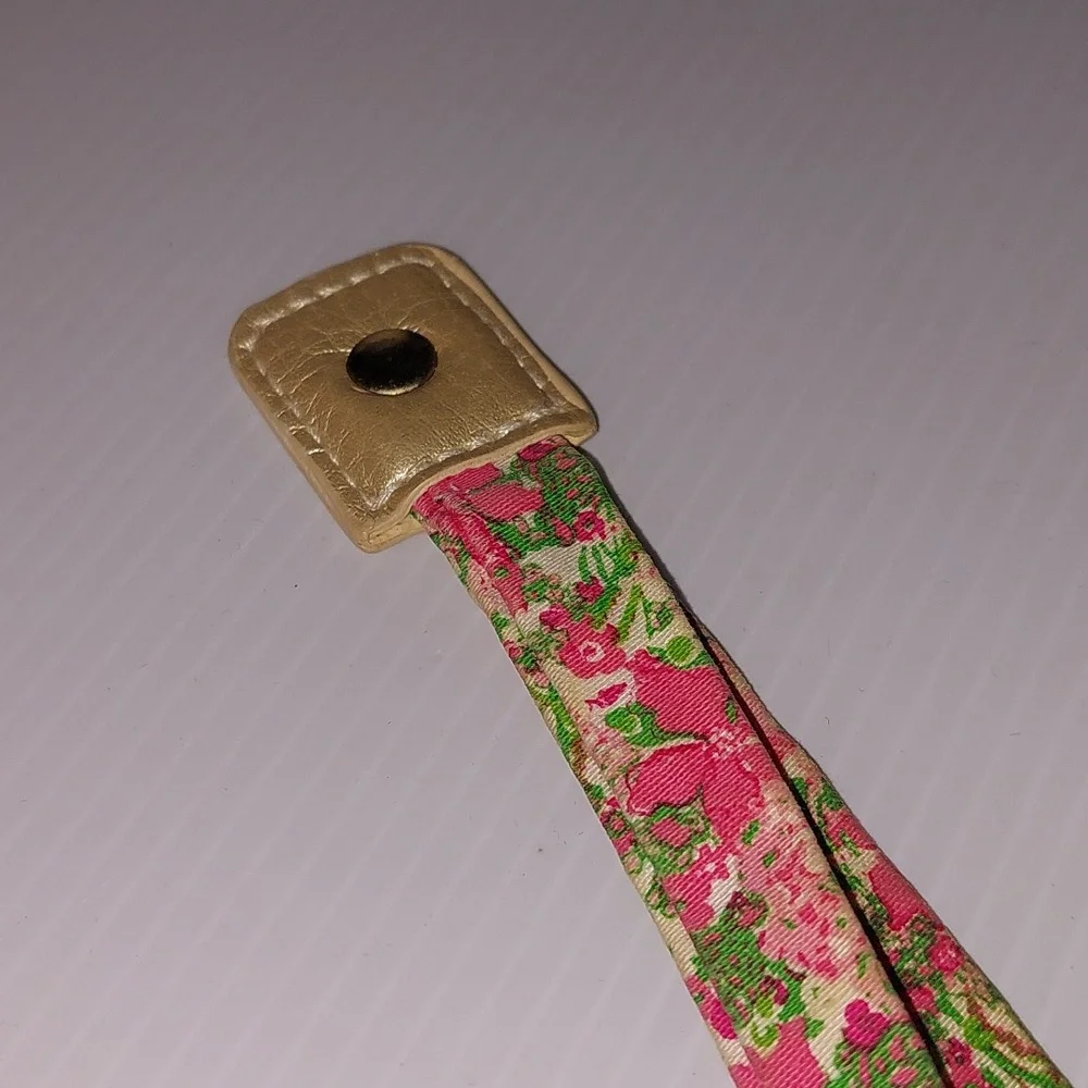 Lilly Pulitzer floral sunglass strap with pink and green colors.